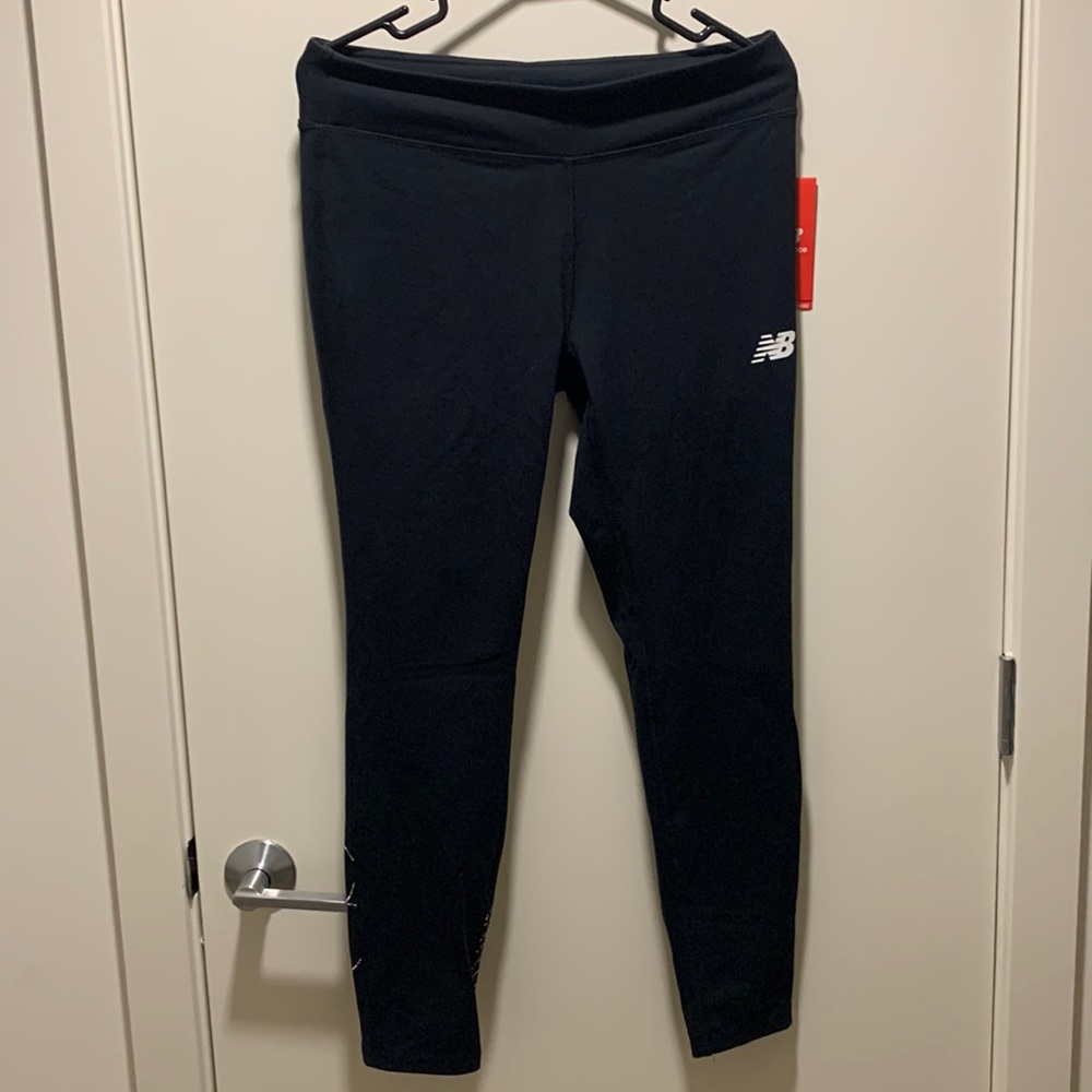 BLACK. NEVER WORN. NEW BALANCE LEGGINGS WITH TAG. FITTED MIDRISE